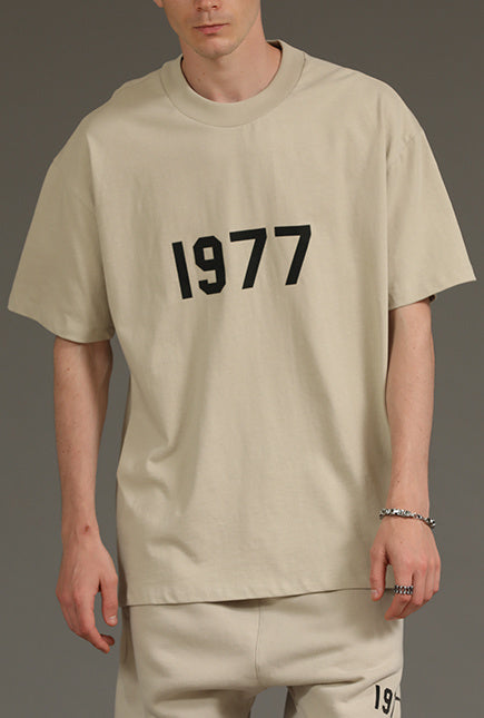 AMBERELLE 1977 Graphic Oversized Short Sleeve T-Shirt in beige