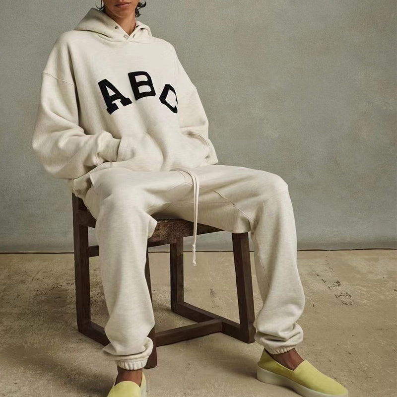 AMBERELLE Varsity Letter Graphic Hoodie in cream