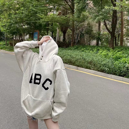 AMBERELLE Varsity Letter Graphic Hoodie in cream