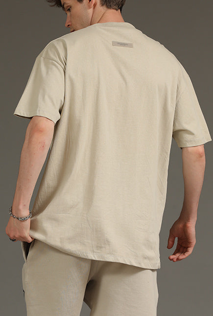 AMBERELLE 1977 Graphic Oversized Short Sleeve T-Shirt in beige