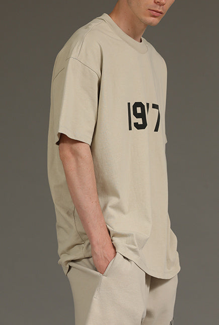 AMBERELLE 1977 Graphic Oversized Short Sleeve T-Shirt in beige
